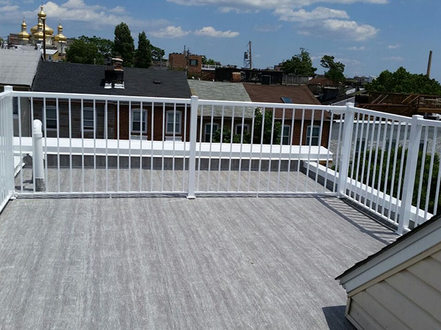 flat roof made into roof deck with Duradek vinyl decking and Durarail aluminum railings