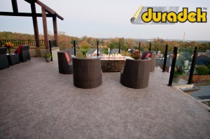 Duradek Macchiato vinyl membrane and Durarail Panorama Post topless glass railing system.