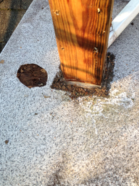 improper waterproofing around a deck post