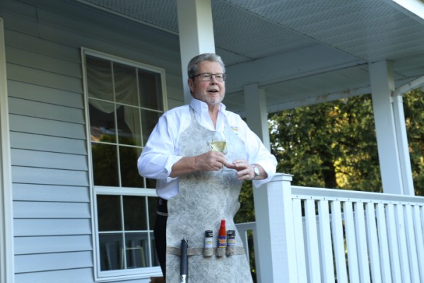 Trevor Daniel makes his retirement speech wearing his commemorative Duradek vinyl barbecue apron </br><figcaption id=