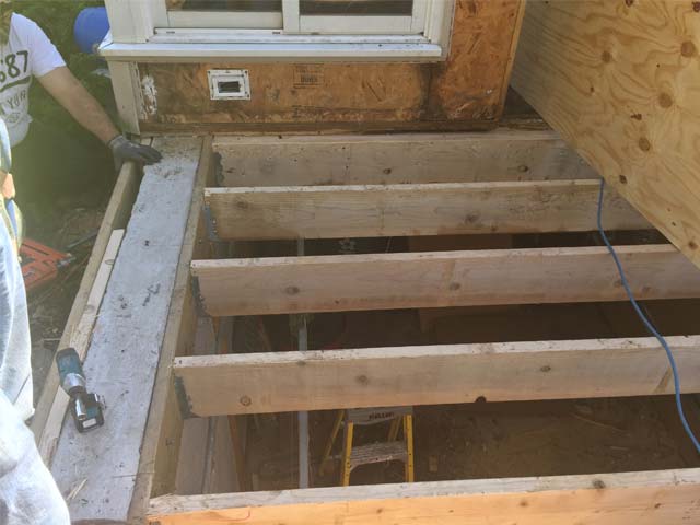 Porch renovation removing wood rot to joists