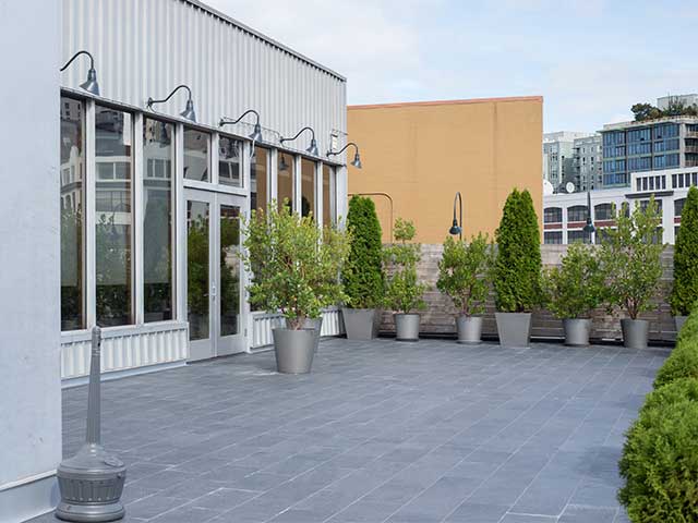 exterior tile rooftop patio repair & renovation with Tiledek waterproof membrane by Duradek.
