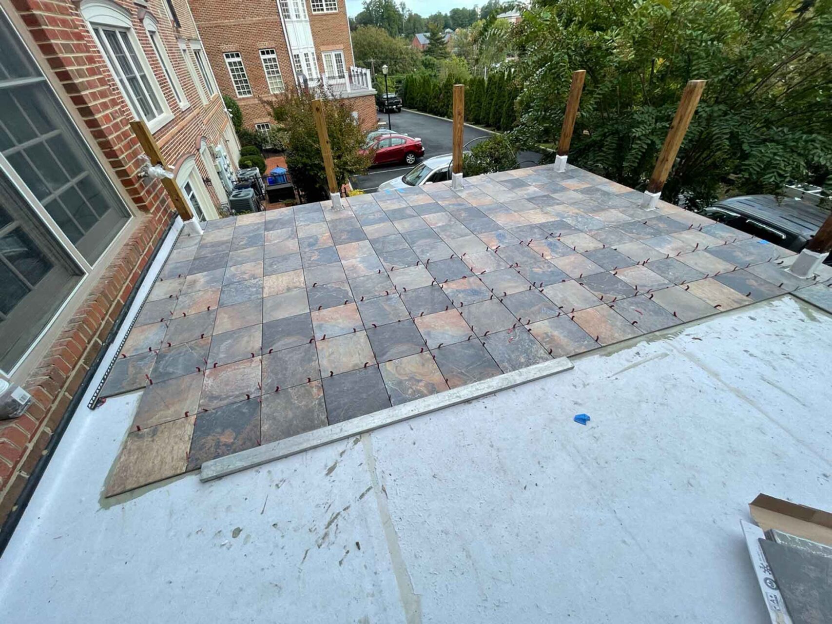 Tile being laid on Tiledek membrane over on roof deck.