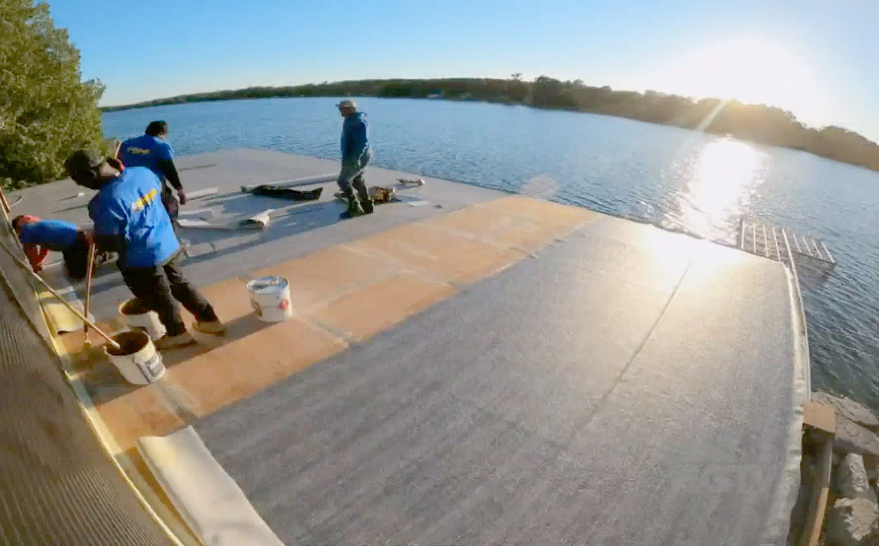Duradek vinyl application on a boathouse roof deck renovation.